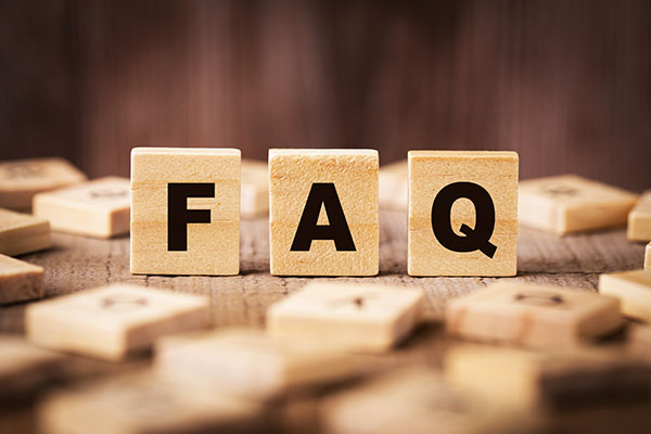 FAQ Sign With Wooden Background