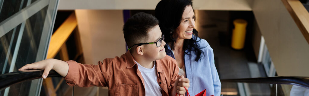 A mother and her son with Down syndrome enjoy a day of shopping at the mall.