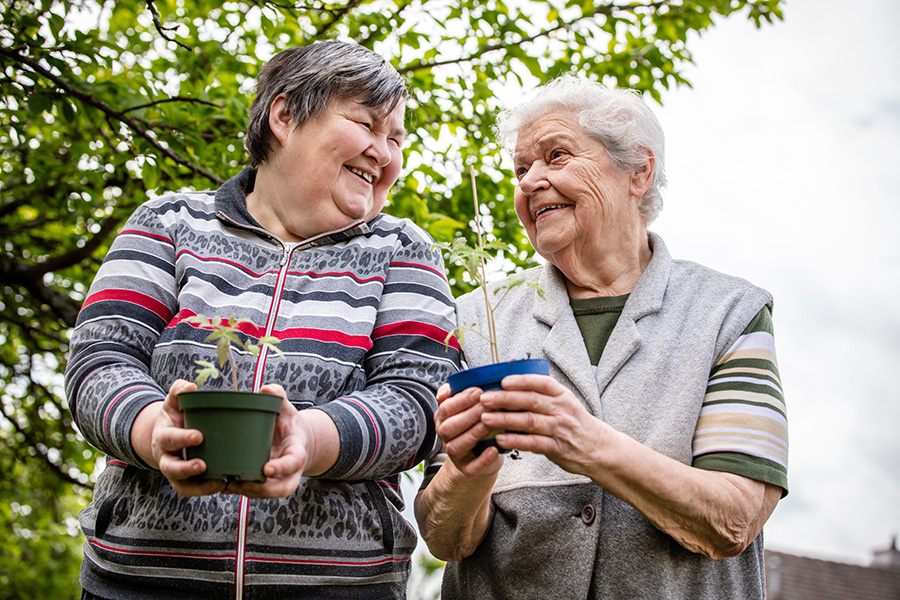 Two women gardening together